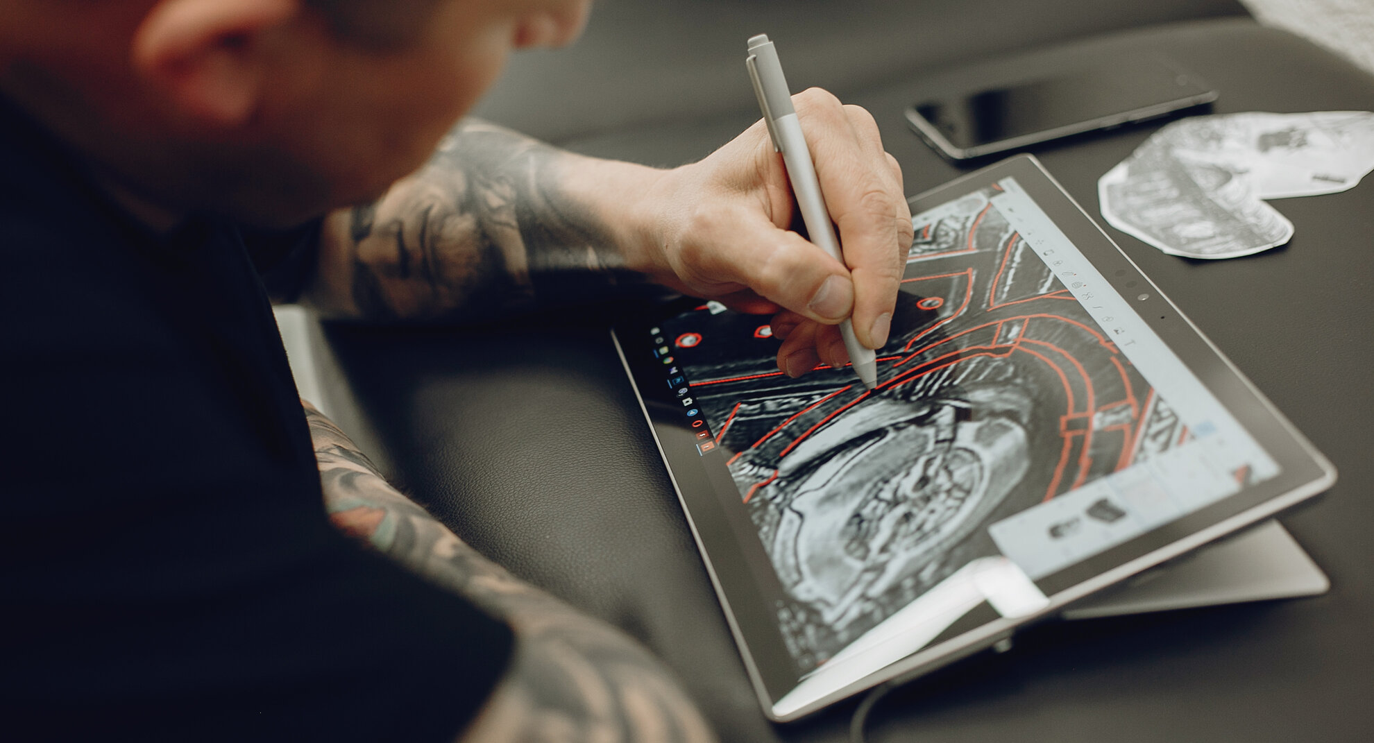 Image of a man working on a digital design