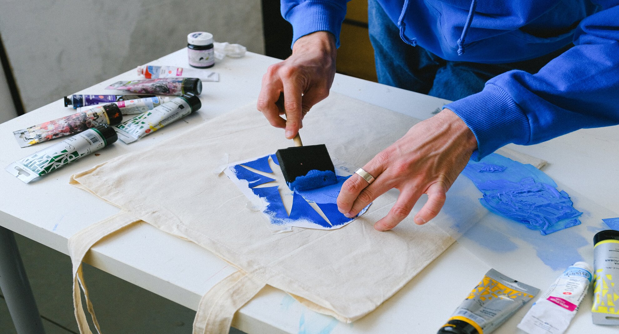 image of someone painting with a stencil